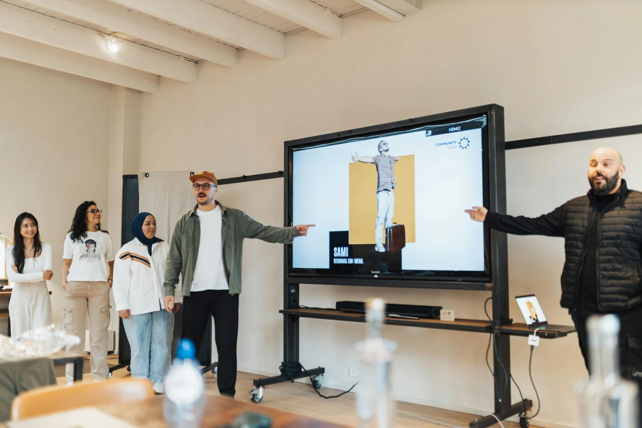 Team analyzing community data and engagement metrics on screens